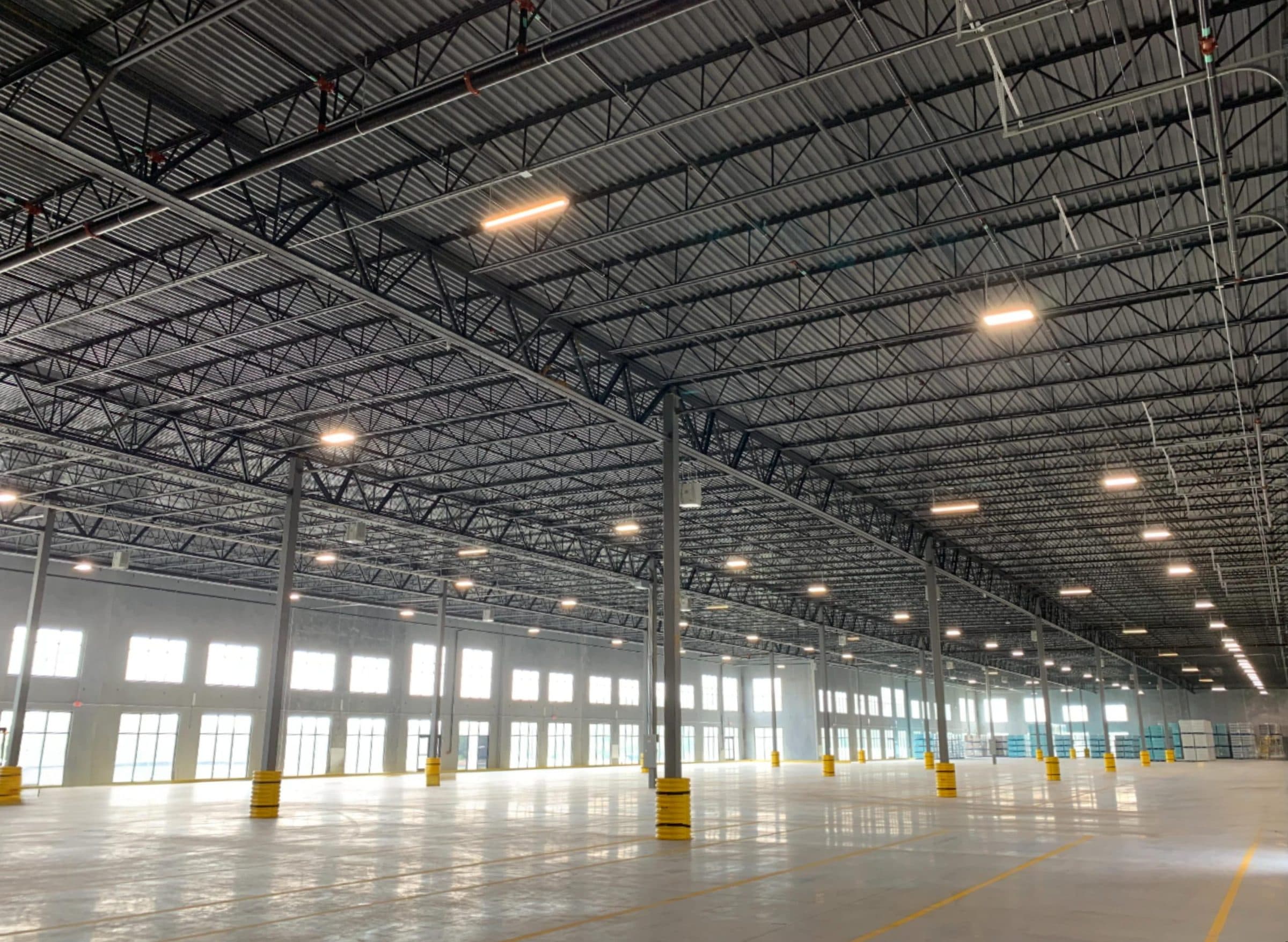 Warehouse interior at Duck Creek Buildings 18 and 19 with rows of high-bay lights