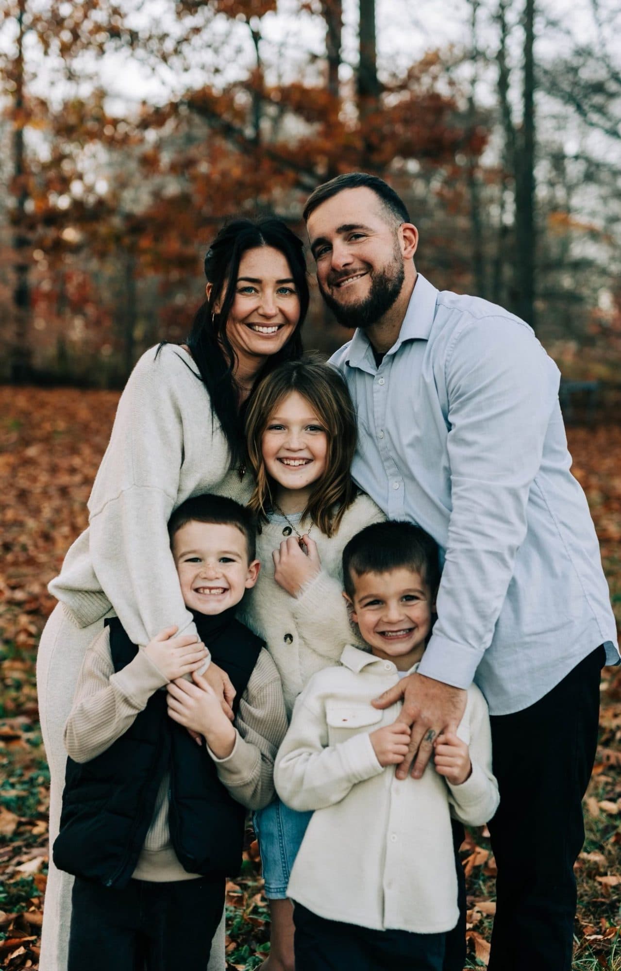 The Ksiazek family, owners of Filec Electrical Services, outdoors in the fall